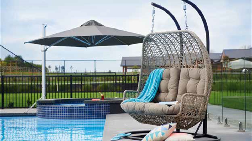 Wicker furniture is always popular and softens an outdoor area. Cushions and throws add pops of colour.